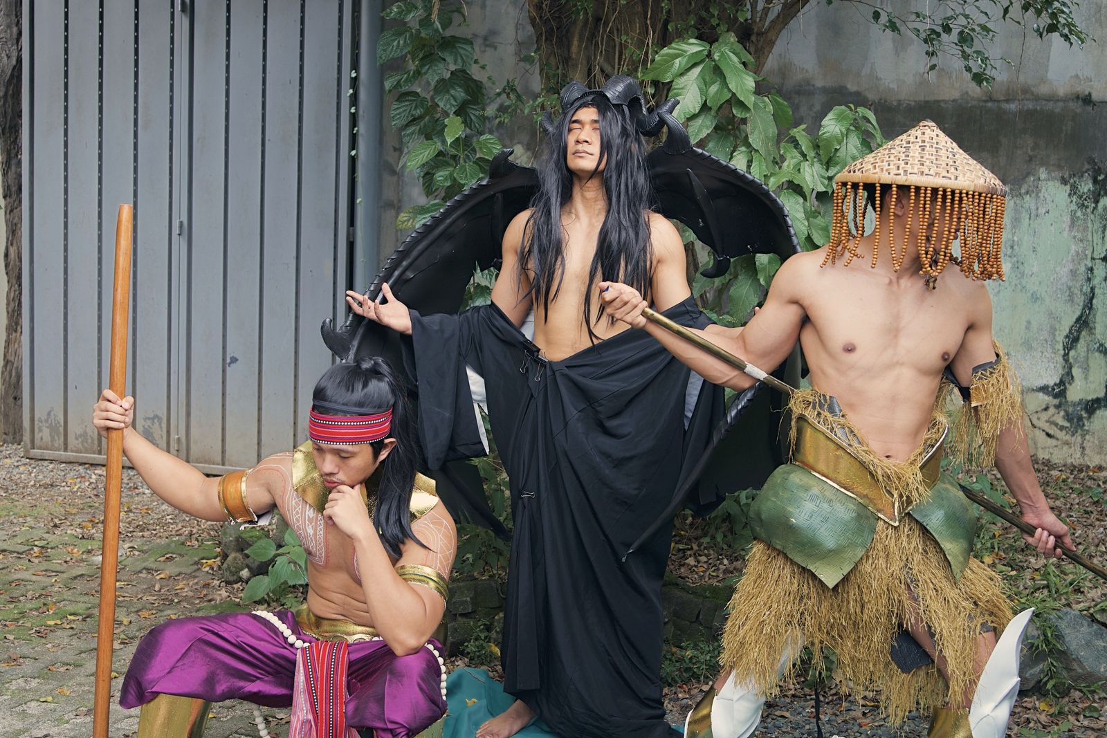 The three costumed models of KSS Vol. 8 — Lakapati, Sitan and Bathala — posing together in the garden at Racket Room Collective